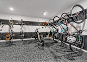 Thumbnail 26 of 39 - A bike shop with bikes hanging on the wall.