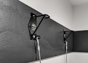 Thumbnail 37 of 39 - A black and white photo of a wall-mounted monitor with a cable attached to it.