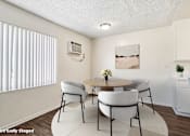 Thumbnail 3 of 19 - A dining room nicely lit by a large window.