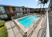 Thumbnail 6 of 21 - A rectangular pool with a metal fence around it.