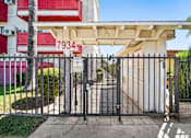 Thumbnail 2 of 17 - A gate with the number 7934 on it is closed.