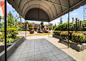 Thumbnail 13 of 19 - A walkway with a canopy leading to the Park Pointe entrance.