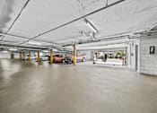 Thumbnail 16 of 19 - A gated parking garage with plenty of parking.