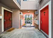 Thumbnail 3 of 7 - A red door is on the right side of the image.