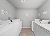 Thumbnail 25 of 27 - A laundromat with washers and dryers.