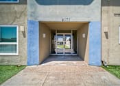 Thumbnail 5 of 10 - The entrance to apartment 327 is shown with a glass door and a small window on the left.