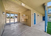 Thumbnail 6 of 10 - A concrete covered balcony with boxes on it.