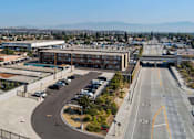 Thumbnail 6 of 17 - A highway interchange with a building in the background.