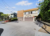 Thumbnail 2 of 20 - A building with a brown and beige facade has a sign that reads "Fair Royal 1236.".
