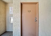 Thumbnail 6 of 33 - A brown door with the number 302 on it.