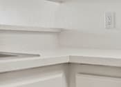 Thumbnail 19 of 29 - A white electrical outlet on a white wall.