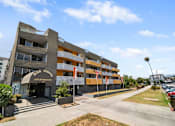 Thumbnail 12 of 19 - A large apartment complex with a sign that reads Park Pointe