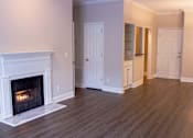 Thumbnail 3 of 12 - Living Room with Fireplace at Lenox Village Apartments, Atlanta, Georgia