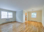 Thumbnail 6 of 22 - A room with wooden floors and two windows at Rivercrest Apartments, New Jersey, 08854
