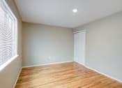 Thumbnail 12 of 13 - A room with wooden flooring and a white door at Seaview Apartments in Staten Island, NY, 10305