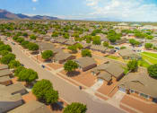 Thumbnail 18 of 31 - an aerial view of the neighborhood of houses with mountains in the background at Community splash park at the Village at Cottonwood Springs, El Paso TX