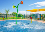 Thumbnail 1 of 31 - a water park with a yellow and red water slide
