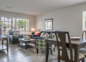 Thumbnail 23 of 31 - Open concept floor plan with living room and dining room at Village of Cottonwood Springs in El Paso, TX