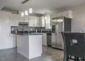 Thumbnail 26 of 31 - a kitchen with white cabinets and stainless steel appliances at Village of Cottonwood Springs, El Paso TX