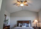Thumbnail 29 of 31 - a bedroom with a ceiling fan and window at Village of Cottonwood Springs in El Paso