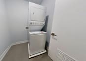 Thumbnail 61 of 61 - A white tankless water heater in a room.