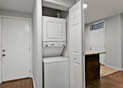 Thumbnail 9 of 15 - an empty laundry room with a washer and dryer in it