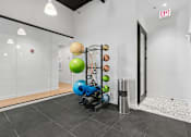 Thumbnail 60 of 84 - A gym room with a variety of exercise equipment.