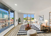 Thumbnail 1 of 54 - A modern living room with a view of the city.