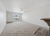 Thumbnail 24 of 37 - A room with a carpeted floor and a ceiling fan.