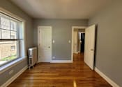Thumbnail 15 of 15 - a living room with wood floors and a large window