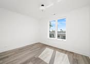 Thumbnail 22 of 27 - A room with a window and a white ceiling.