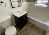 Thumbnail 11 of 14 - a bathroom with a white toilet and a sink