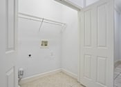 Thumbnail 27 of 46 - A white door is on the right side of the image.