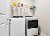 Thumbnail 13 of 37 - A white oven and microwave in a kitchen.