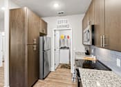Thumbnail 5 of 37 - A laundry sign is on the wall above a washer and dryer.