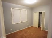 Thumbnail 10 of 14 - a empty room with a window and a closet
