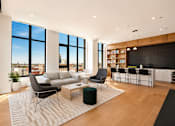 Thumbnail 3 of 18 - A modern living room with a large window overlooking the city.