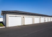 Thumbnail 35 of 46 - A long building with multiple garage doors.