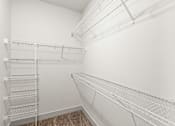 Thumbnail 18 of 50 - Empty white shelves in a room.
