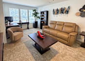 Thumbnail 38 of 48 - A ceiling fan is on in a room with a brown carpet.