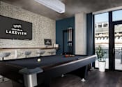 Thumbnail 29 of 31 - A pool table in a room with a sign that says "Centrum Lakeview".