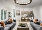 Thumbnail 21 of 46 - A modern living room with grey sofas and a wooden coffee table.