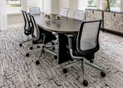 Thumbnail 29 of 46 - A conference room with a table and chairs.