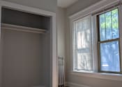 Thumbnail 6 of 19 - A room with a window and a radiator on the wall.