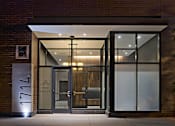 Thumbnail 28 of 31 - The entrance to a building with a glass door and a sign that reads "1777".