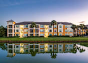 Thumbnail 1 of 71 - A large building with a reflection in the water in front of it.
