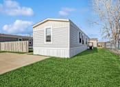 Thumbnail 20 of 25 - Model home exterior at Cedar Ridge Manufactured Home Community  in Wichita, Kansas