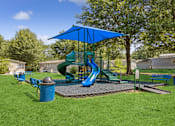 Thumbnail 14 of 15 - Playground with sun cover at Southfork MHC in Belton, MO