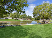 Thumbnail 10 of 15 - Private lake and greenscape at Southfork MHC in Belton, MO
