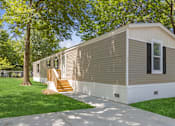 Thumbnail 6 of 15 - Model home exterior at Southfork MHC in Belton, MO